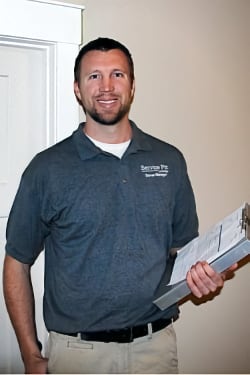Dan Homrich holding a clipboard