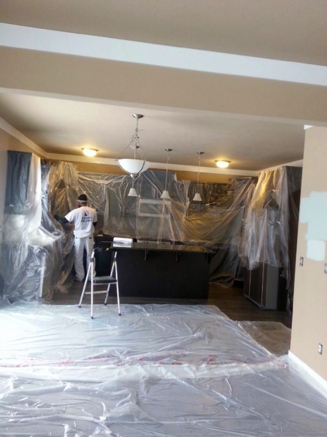 basement floor covered in plastic ready to paint