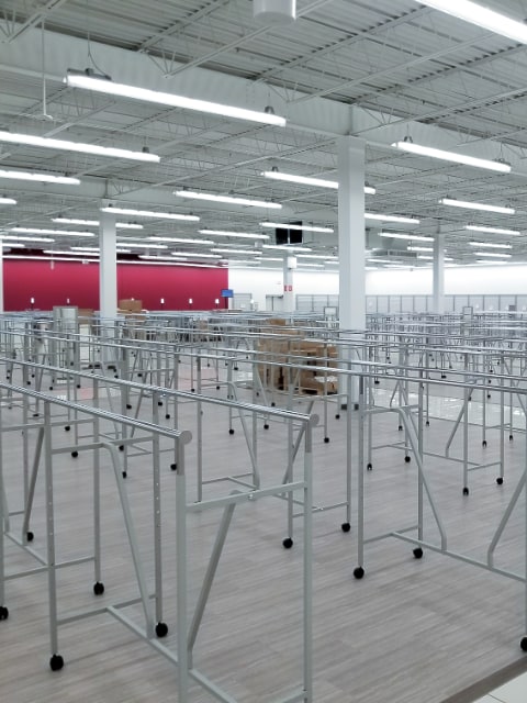 empty clothing racks in an empty store